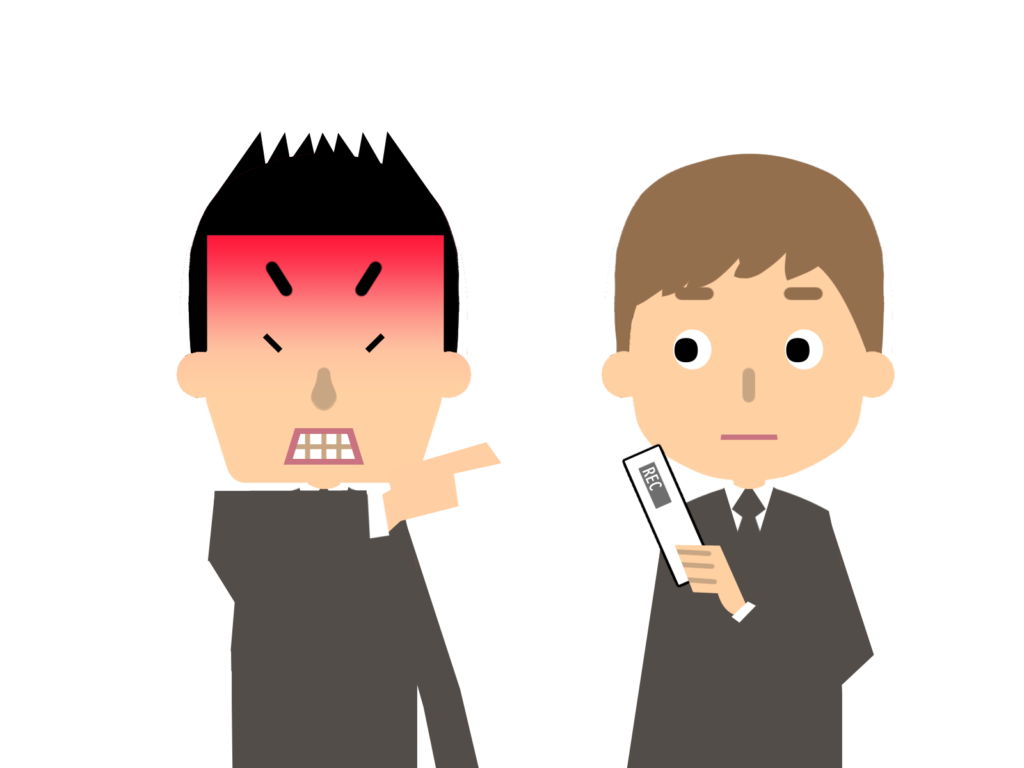 怒る上司に録音機を向ける部下